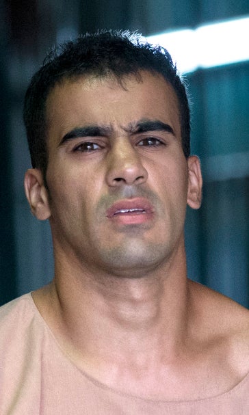 Refugee footballer freed by Thailand returns to Australia
